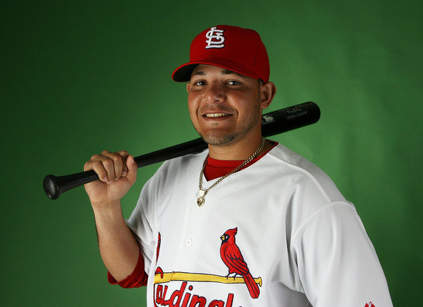 Yadier Molina Yadier Molina #4 of the St. Louis Cardinals poses during photo day at Roger Dean Stadium on February 20, 2009 in Jupiter, Florida. (Photo by Doug Benc/Getty Images) *** Local Caption *** Yadier Molina